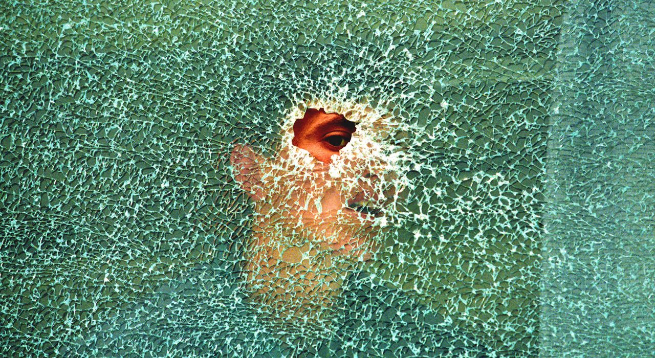Pristina, Kosovo, 1998 ©Yannis Behrakis/Reuters
An ethnic Albanian villager looks through a bullet hole in a bus window in the village of Lapusnik 20 km south-west of Kosovo's capital Pristina, May 11, 1998.